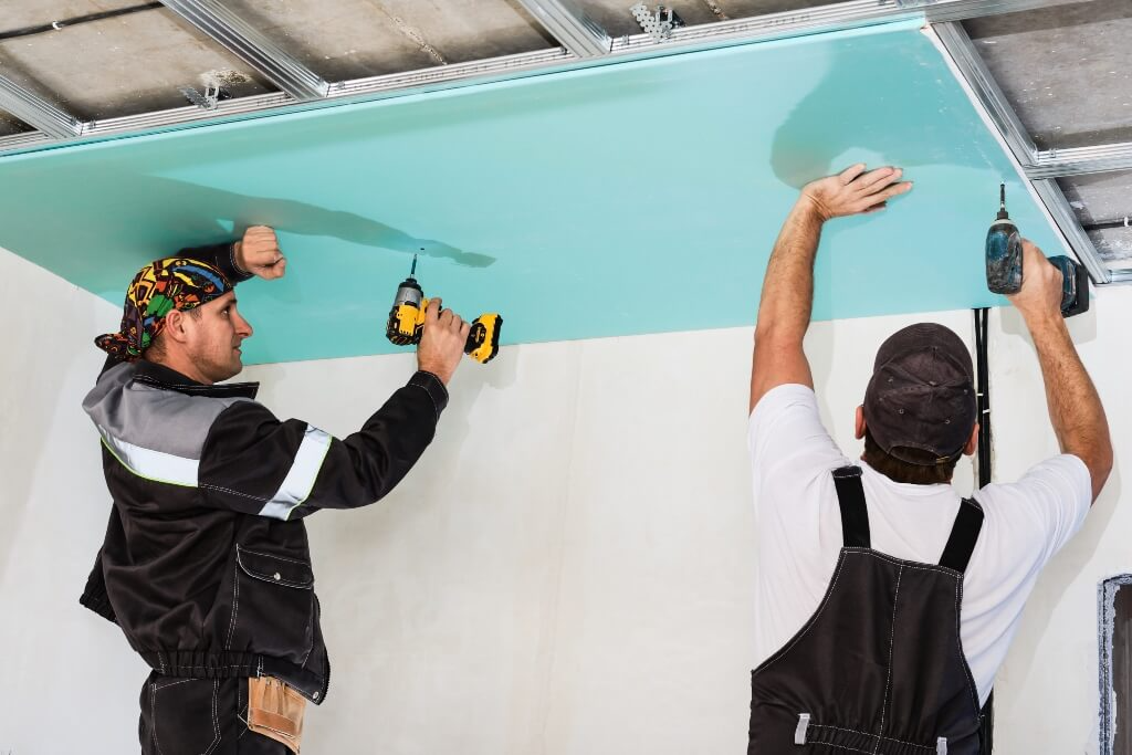 Two-men-installing-plasterboard