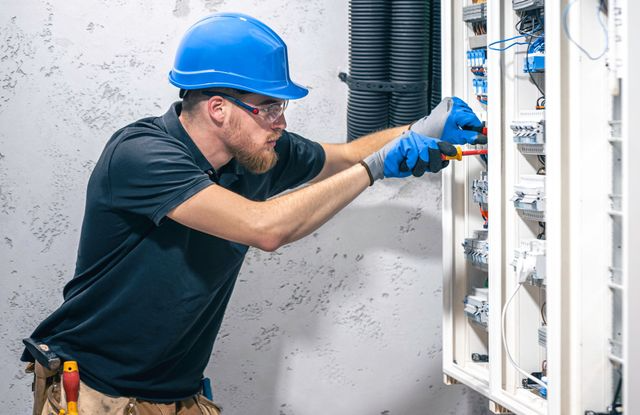 male-electrician-works-switchboa (1)